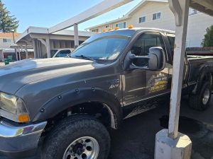 Silver Ridge Junk Removal truck with dump trailer ready for junk hauling in Reno, NV