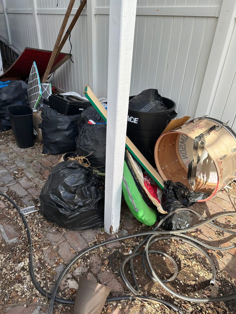 Yard area with junk and debris before cleanup in Reno, NV